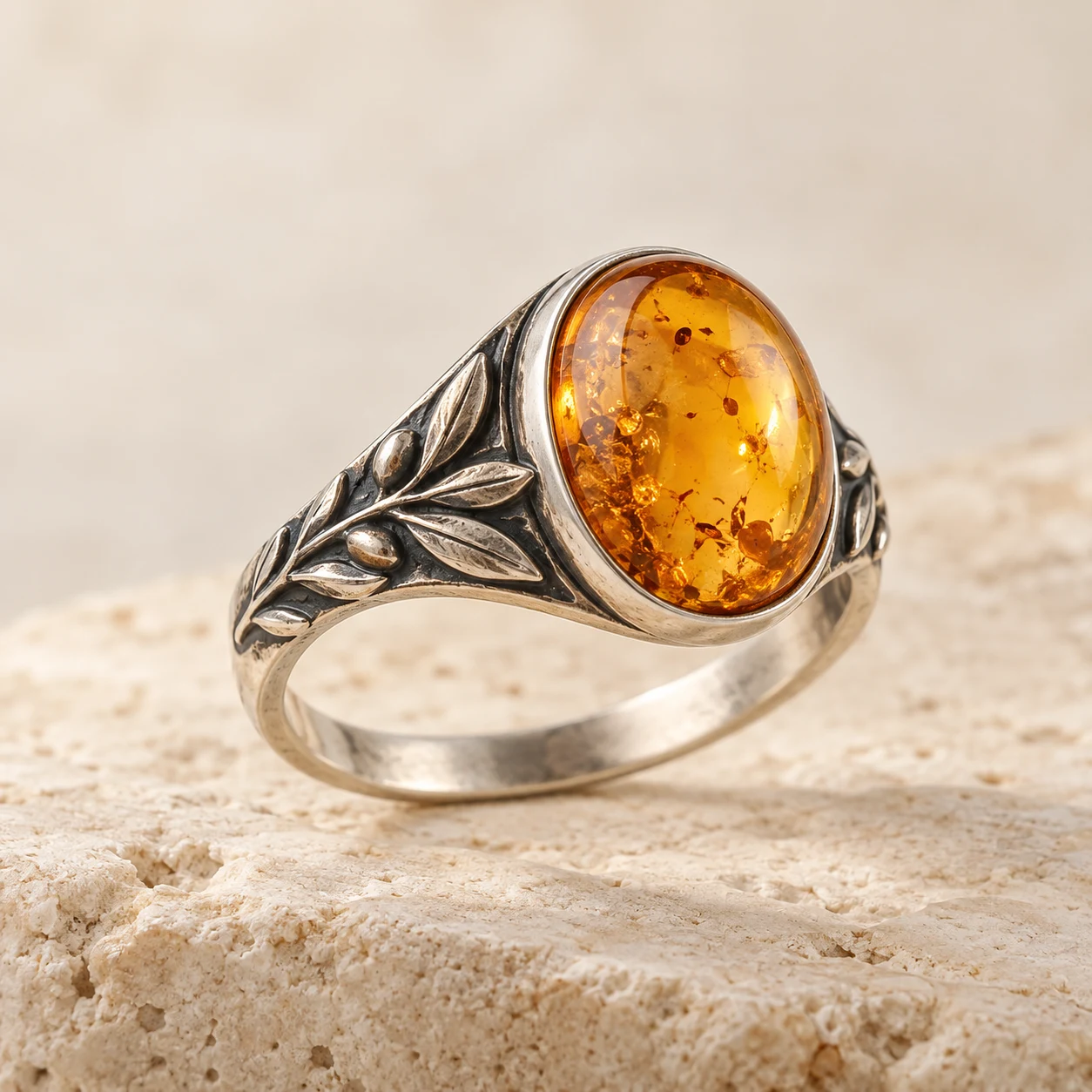 Olive Grove: golden-honey oval amber ring with olive leaves